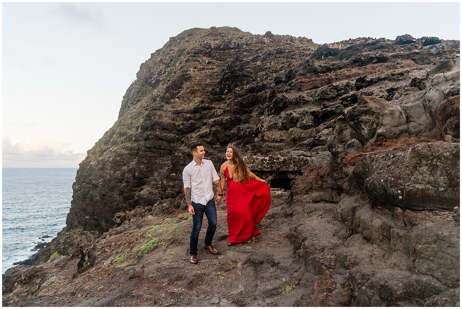 Couple laughing while taking photos at Makapuu on Oahu
