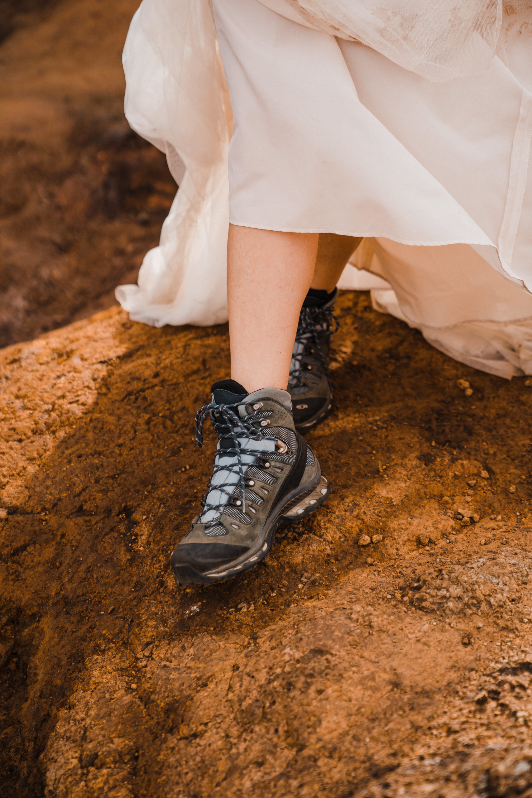 bride wearing hiking boots for elopement