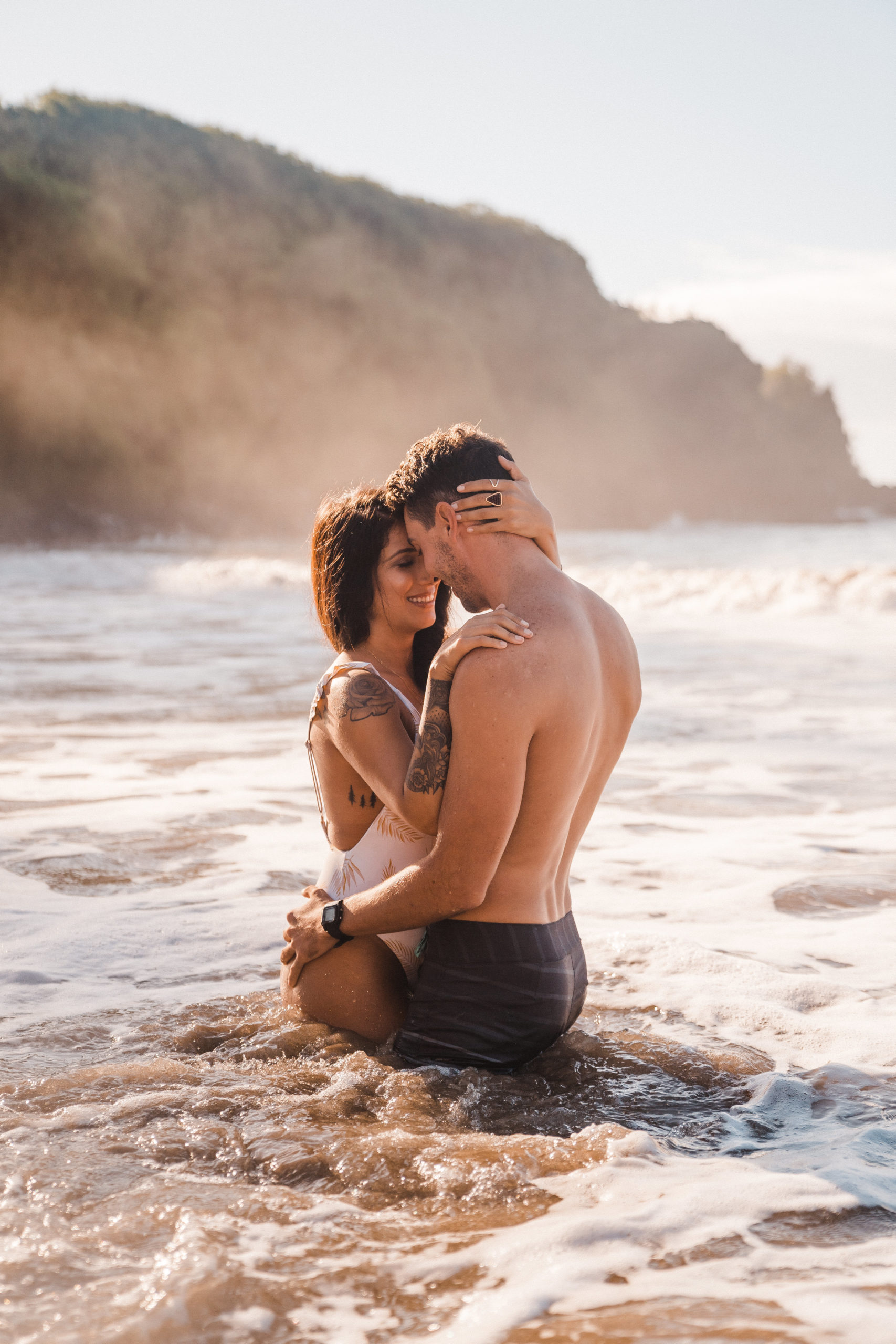romantic couple in the ocean photoshoot