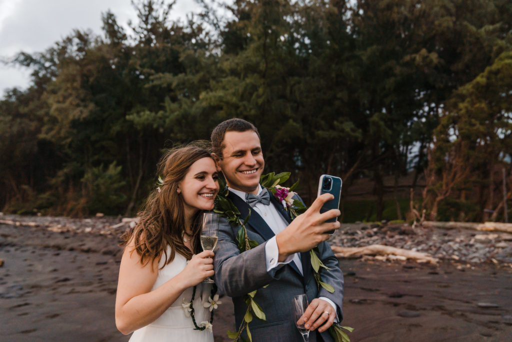 bride and groom taking selfie together