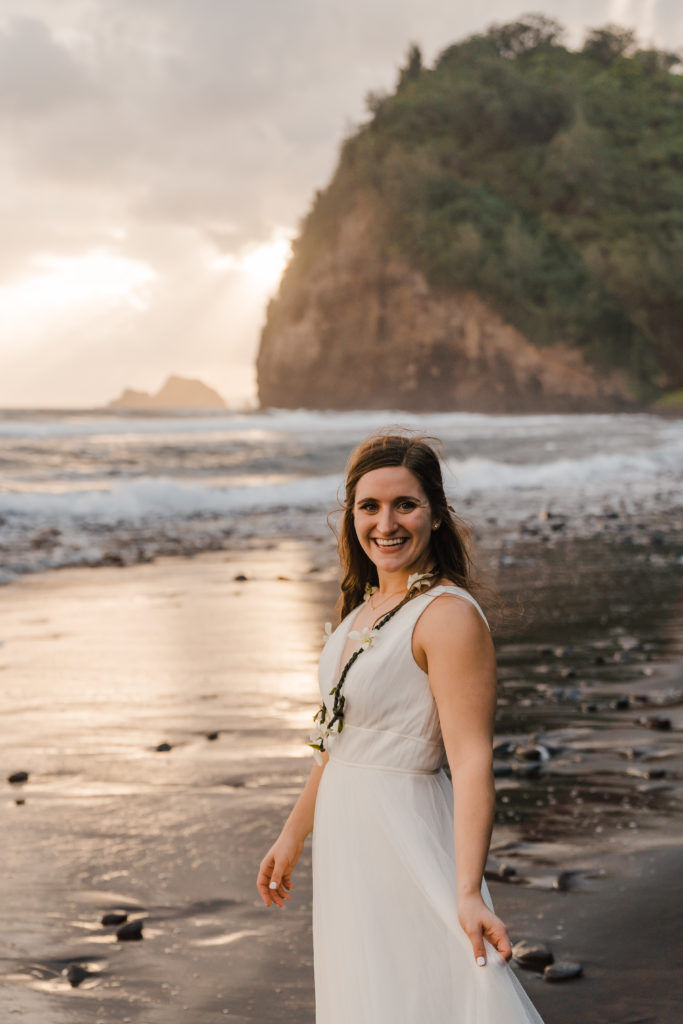 portrait of bride on black sand beach in hawaii