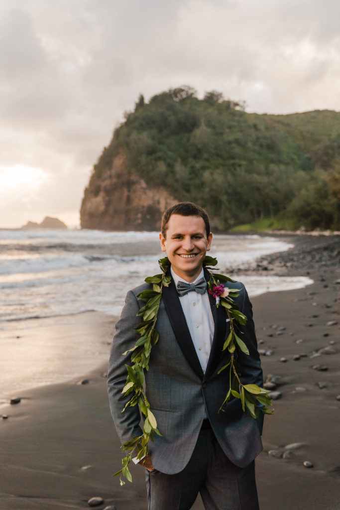 portrait of groom on black sand beach pololu valley