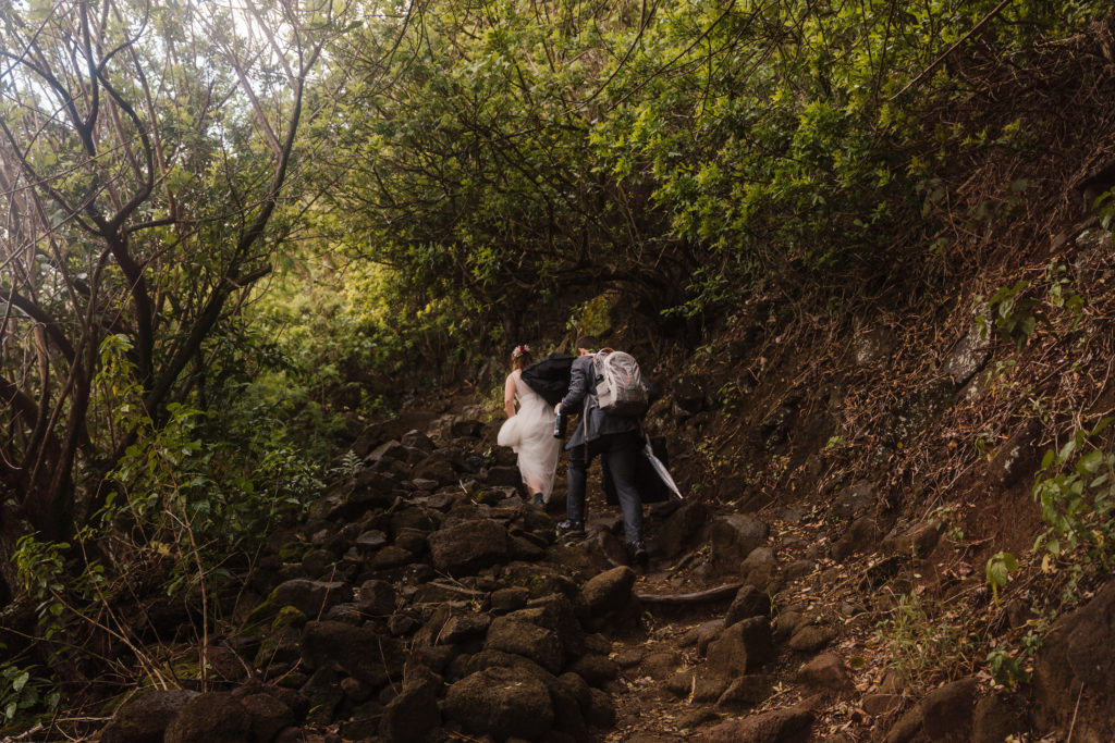 Bride and groom hiking on their elopement day