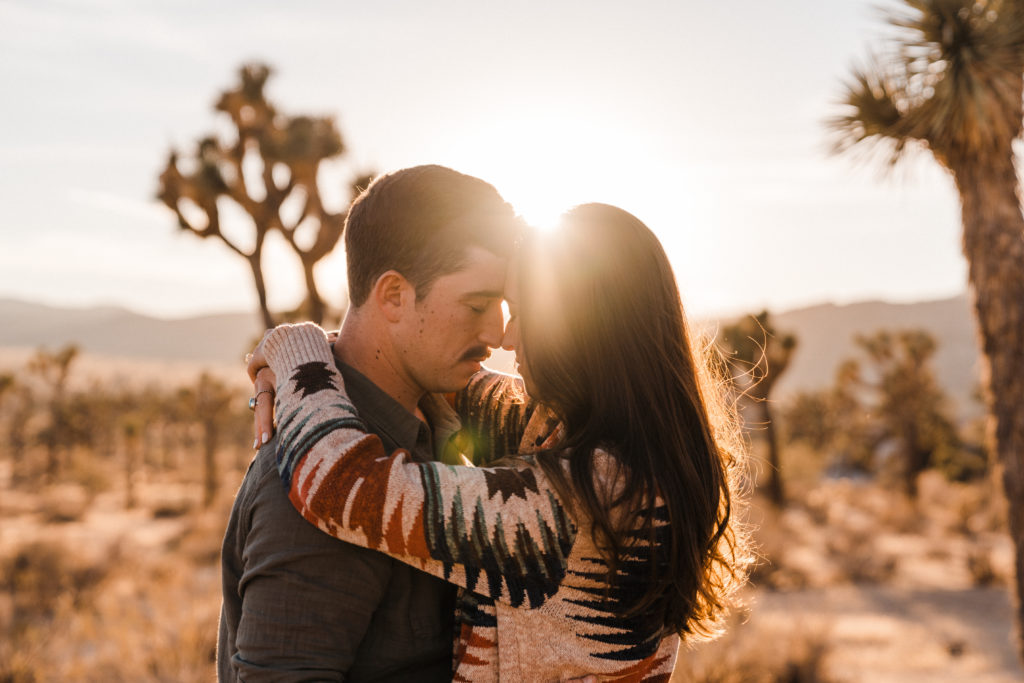 couple taking engagement pictures in joshua tree california