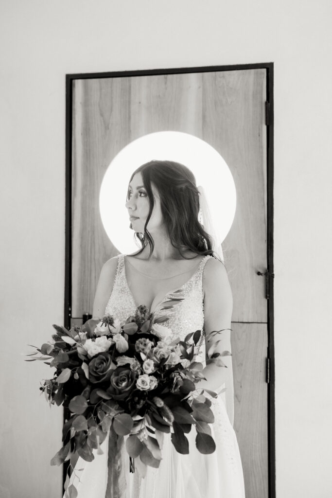 side profile black and white portrait of bride at desert airbnb in joshua tree