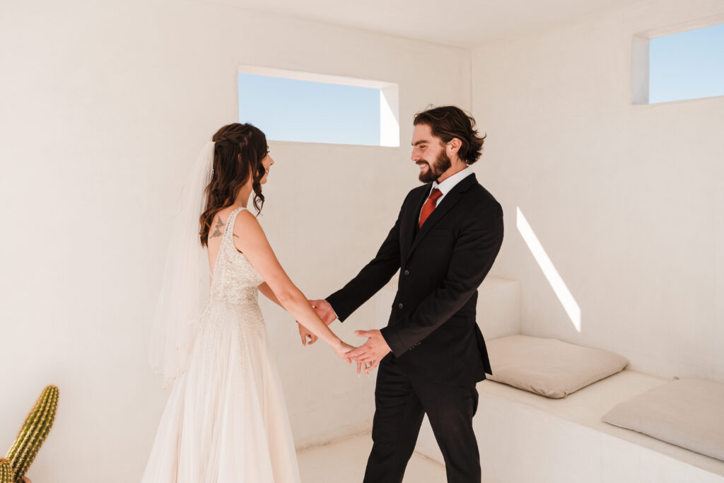 joshua tree airbnb wedding first look with bride and groom